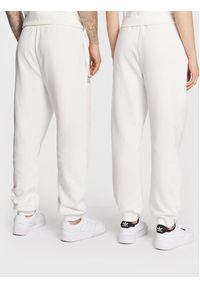 Ellesse Spodnie dresowe Unisex Dimartino SGP16249 Biały Regular Fit. Kolor: biały. Materiał: dresówka, bawełna