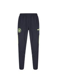 Puma - Spodnie przedmeczowe Manchester City 2022/23. Kolor: wielokolorowy, niebieski, żółty. Sport: piłka nożna #1