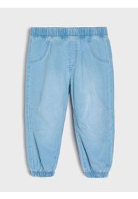 Sinsay - Spodnie jeansowe jogger loose - niebieski. Kolor: niebieski #1