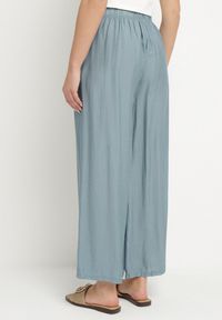Born2be - Jasnoniebieskie Szerokie Spodnie Typu Palazzo z Wysokim Stanem Varlevi. Okazja: na co dzień. Stan: podwyższony. Kolor: niebieski. Styl: elegancki, casual