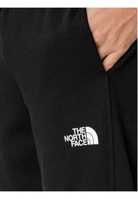 The North Face Spodnie dresowe Standard NF0A4M7L Czarny Regular Fit. Kolor: czarny. Materiał: bawełna #5