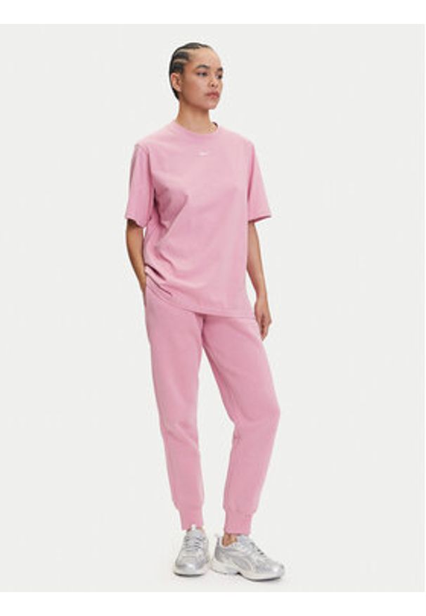 Nike Spodnie dresowe Sportswear Phoenix Fleece FZ7626 Różowy Regular Fit. Kolor: różowy. Materiał: bawełna