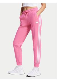 Adidas - adidas Spodnie dresowe Future Icons 3-Stripes IS3942 Różowy Regular Fit. Kolor: różowy. Materiał: bawełna, syntetyk #1