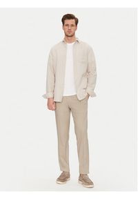Calvin Klein Chinosy K10K114104 Beżowy Tapered Fit. Kolor: beżowy. Materiał: bawełna