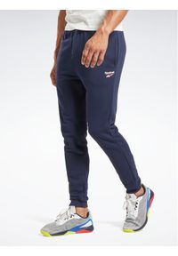 Reebok Spodnie dresowe Identity H49681 Granatowy Regular Fit. Kolor: niebieski. Materiał: bawełna