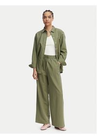 Tommy Jeans Spodnie materiałowe DW0DW22285 Zielony Loose Fit. Kolor: zielony. Materiał: len #2