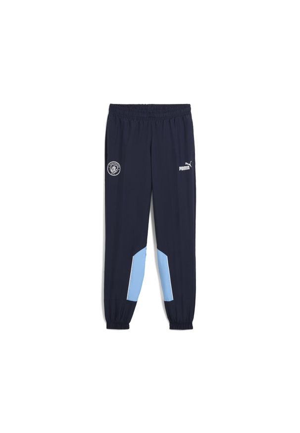 Puma - Młodzieżowe spodnie Manchester City ftblARCHIVE PUMA Navy Team Light Blue. Kolor: niebieski. Materiał: dresówka. Sport: piłka nożna