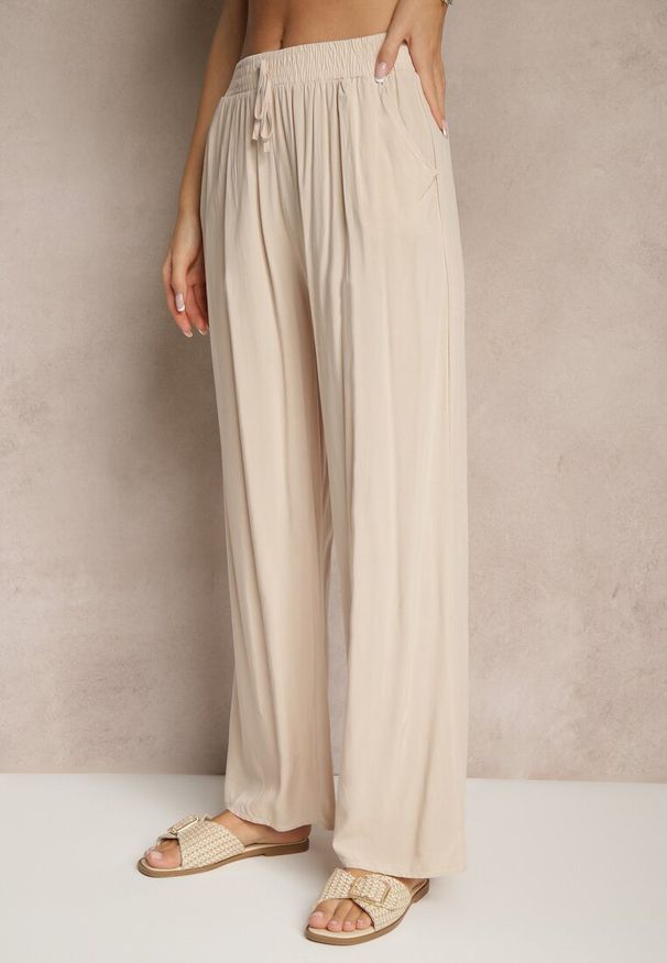 Renee - Beżowe Spodnie z Wiskozy High Waist o Szerokim Kroju Avelozi. Okazja: na co dzień. Stan: podwyższony. Kolor: beżowy. Materiał: wiskoza. Styl: elegancki, casual