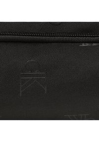 Calvin Klein Saszetka Sport Essentials Camerabag 18 Aop K50K510093 Czarny. Kolor: czarny. Materiał: materiał