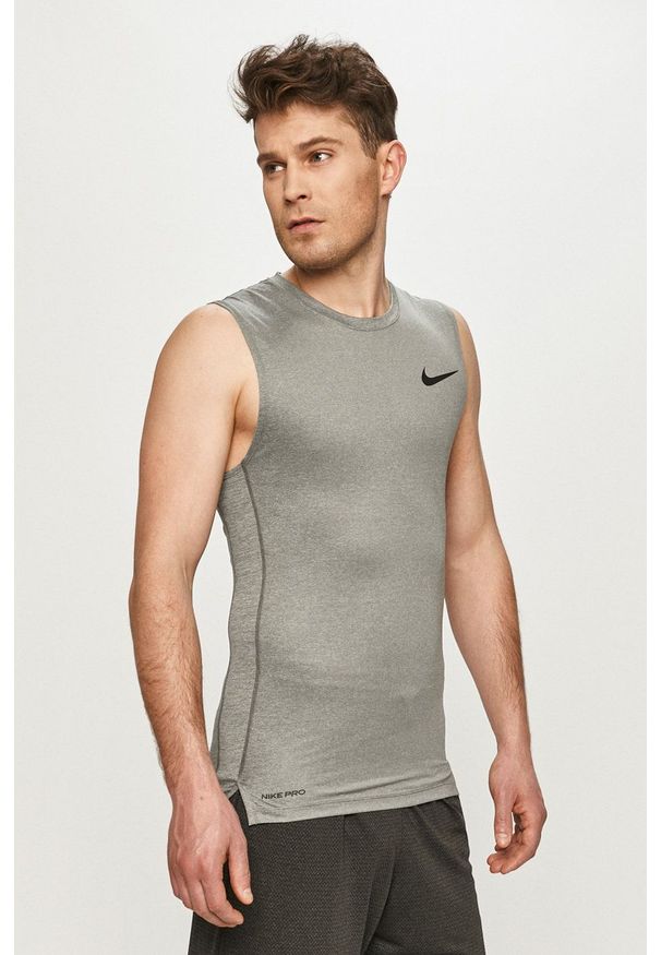 Nike - T-shirt. Kolor: szary. Materiał: tkanina, skóra, dzianina, włókno