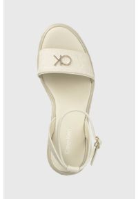 Calvin Klein sandały WEDGE 50HH W/HW - JQ damskie kolor beżowy na koturnie HW0HW01490. Zapięcie: klamry. Kolor: beżowy. Materiał: skóra, guma. Obcas: na koturnie #4