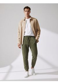 Sinsay - Spodnie jogger - zielony. Kolor: zielony