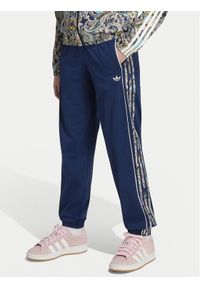 Adidas - adidas Spodnie dresowe Sst KR9187 Granatowy Loose Fit. Kolor: niebieski. Materiał: syntetyk #1