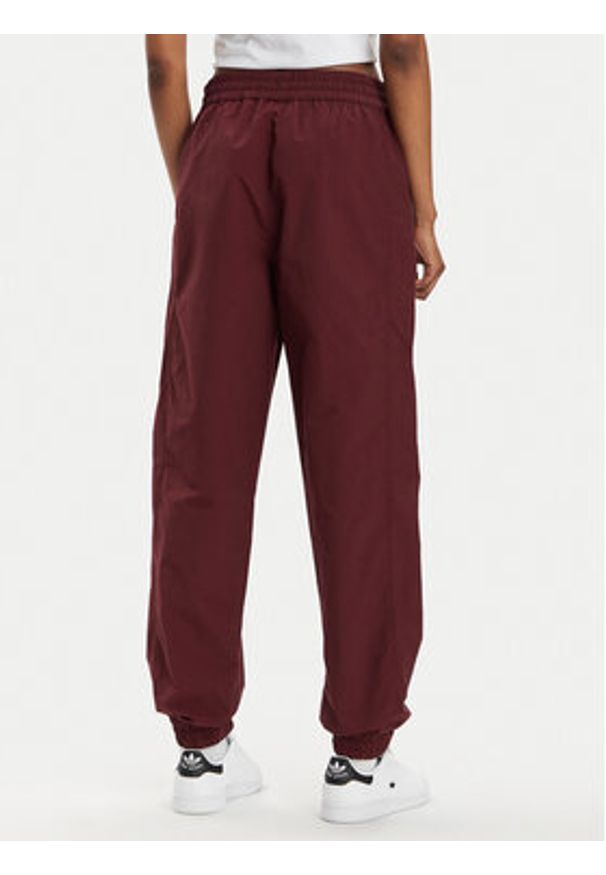 Converse Spodnie dresowe Star Printer 10026055-A02 Bordowy Tapered Fit. Kolor: czerwony. Materiał: syntetyk