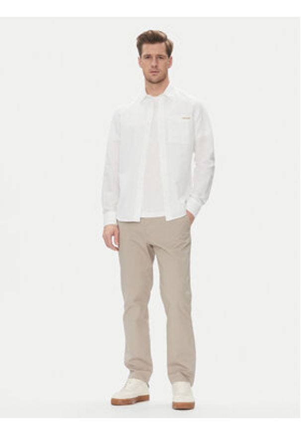 Calvin Klein Jeans Chinosy LV040EM628 Beżowy Slim Fit. Kolor: beżowy. Materiał: bawełna