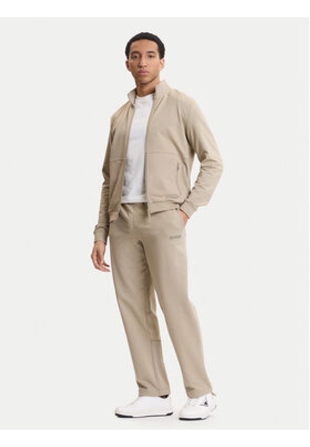 Guess Spodnie dresowe Z6GB01 K2834 Beżowy Regular Fit. Kolor: beżowy. Materiał: bawełna