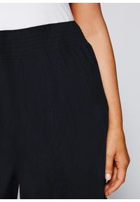 bonprix - Spodnie palazzo z lejącej się wiskozy. Kolor: czarny. Materiał: wiskoza #2