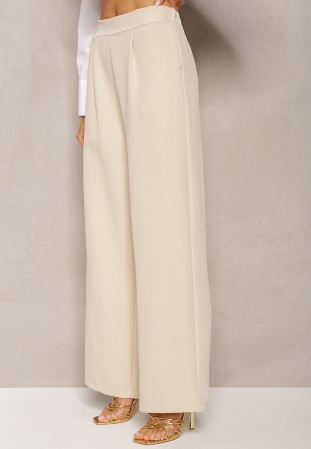 Renee - Jasnobeżowe Szerokie Spodnie w Eleganckim Stylu Hanessame. Kolor: beżowy. Styl: elegancki
