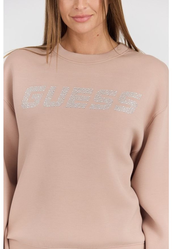 Guess - GUESS Beżowa damska bluza z cyrkoniami Cecilia, Rozmiar L. Kolor: czarny. Materiał: poliamid, wiskoza, materiał, elastan. Długość rękawa: długi rękaw. Długość: długie. Styl: elegancki