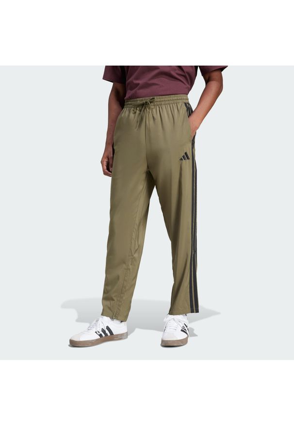 Adidas - Spodnie Essentials 3-Stripes Stanford Open Hem. Kolor: wielokolorowy, czarny, beżowy. Materiał: materiał. Sport: fitness