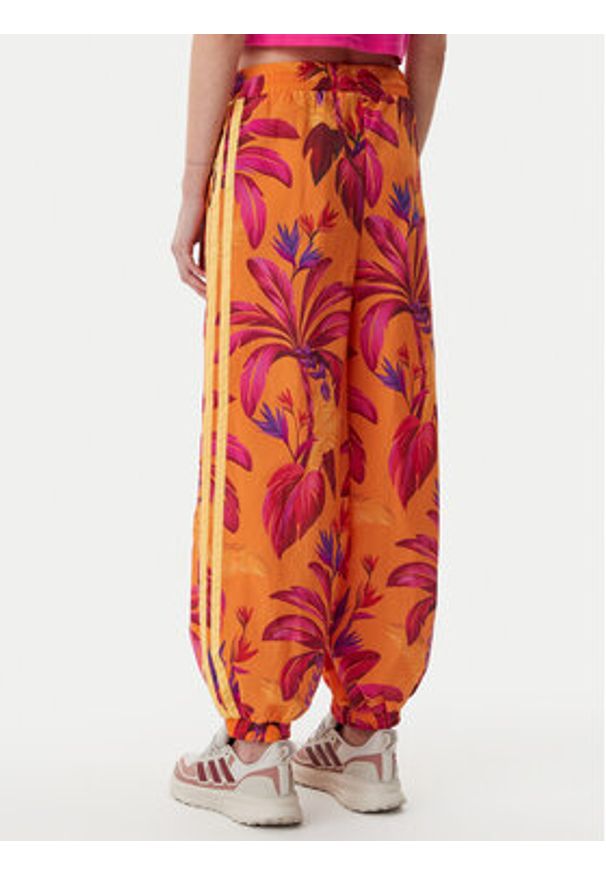 Adidas - adidas Spodnie dresowe FARM Premium JD6301 Pomarańczowy Loose Fit. Kolor: pomarańczowy. Materiał: syntetyk