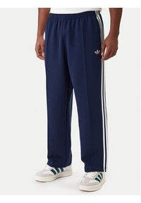 Adidas - adidas Spodnie dresowe adicolor Spacer Track KD4087 Granatowy Baggy Fit. Kolor: niebieski. Materiał: bawełna. Sport: turystyka piesza #7