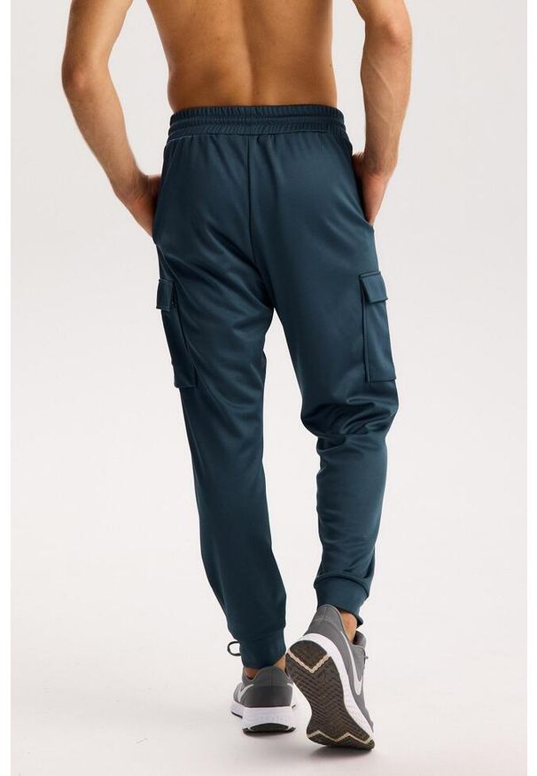ROUGH RADICAL - Męskie spodnie dresowe Rough Radical Dynamic Pro Joggers Men. Kolor: niebieski. Materiał: dresówka. Sport: fitness