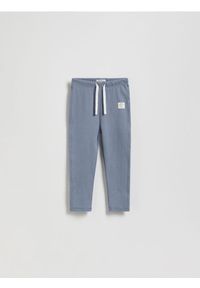 Reserved - Bawełniane legginsy z naszywką - niebieski. Kolor: niebieski. Materiał: bawełna. Wzór: aplikacja