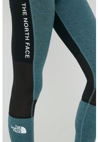 The North Face legginsy sportowe Mountain Athletics damskie kolor czarny wzorzyste. Kolor: czarny. Materiał: skóra, materiał, włókno. Styl: sportowy