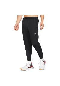 Spodnie męskie do biegania Nike Essential Division CU7882. Materiał: materiał, poliester. Technologia: Dri-Fit (Nike). Sport: fitness #1