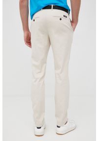 Calvin Klein spodnie męskie kolor beżowy dopasowane. Kolor: beżowy. Materiał: tkanina, bawełna. Wzór: gładki #2
