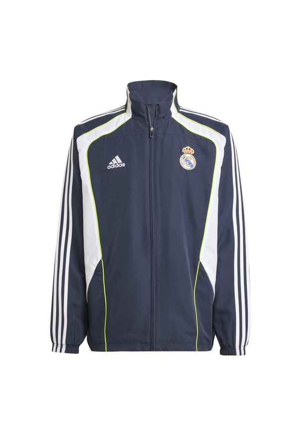 Adidas - Dres Real Madrid Ubp Tt Blnanu 2024/25. Kolor: niebieski, wielokolorowy, biały. Materiał: dresówka. Sport: piłka nożna