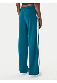 Adidas - adidas Spodnie dresowe Firebird KG3701 Zielony Loose Fit. Kolor: zielony. Materiał: syntetyk #2
