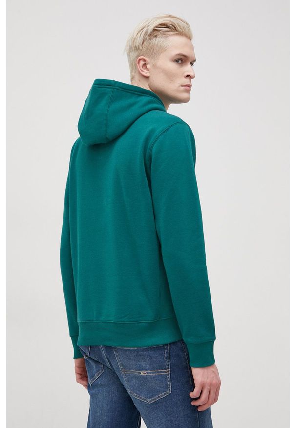 Tommy Jeans Bluza męska kolor zielony z kapturem gładka. Okazja: na co dzień. Typ kołnierza: kaptur. Kolor: zielony. Materiał: bawełna, dzianina. Wzór: gładki. Styl: casual