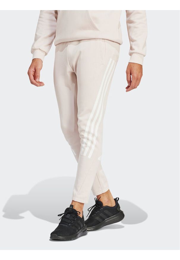 Adidas - adidas Spodnie dresowe Future Icons 3-Stripes IR9155 Różowy Slim Fit. Kolor: różowy. Materiał: bawełna