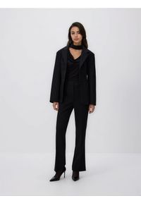 Reserved - Spodnie z rozcięciem - czarny. Kolor: czarny. Materiał: tkanina, wiskoza #1