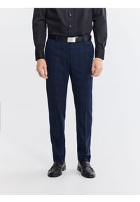 Reserved - Garniturowe spodnie slim fit - granatowy. Kolor: niebieski. Materiał: tkanina, wiskoza #1