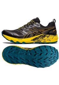 Buty do biegania Asics Gel-Trabuco Terra M 1011B029 010 czarne czarne. Zapięcie: sznurówki. Kolor: czarny. Materiał: syntetyk, guma, materiał. Szerokość cholewki: normalna