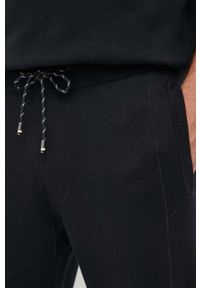 BOSS spodnie dresowe z domieszką wełny kolor czarny melanżowe. Kolor: czarny. Materiał: wełna, dresówka. Wzór: melanż #3