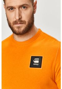 G-Star RAW - G-Star Raw - T-shirt. Okazja: na co dzień. Kolor: pomarańczowy. Materiał: dzianina. Wzór: gładki, aplikacja. Styl: casual