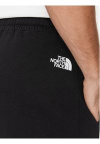 The North Face Spodnie dresowe Standard NF0A4M7L Czarny Regular Fit. Kolor: czarny. Materiał: bawełna #6