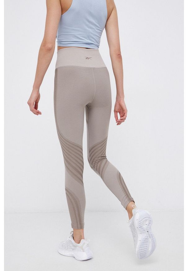 Reebok Classic - Legginsy. Kolor: beżowy. Materiał: dzianina. Wzór: gładki