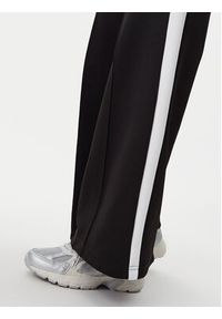 Puma Spodnie dresowe T7 629803 Czarny Wide Leg. Kolor: czarny. Materiał: syntetyk