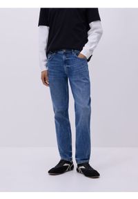 Reserved - Jeansy slim z efektem sprania - niebieski. Kolor: niebieski