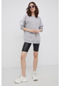 Adidas - adidas Bluza damska kolor szary melanżowa. Kolor: szary. Materiał: dzianina, poliester, bawełna. Długość rękawa: długi rękaw. Długość: długie. Wzór: melanż