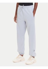 Adidas by Stella McCartney - adidas by Stella McCartney Spodnie dresowe JX6777 Szary Loose Fit. Kolor: szary. Materiał: bawełna
