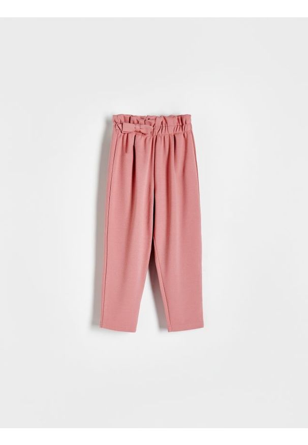 Reserved - Dzianinowe spodnie z kokardką - brudny róż. Kolor: różowy. Materiał: dzianina