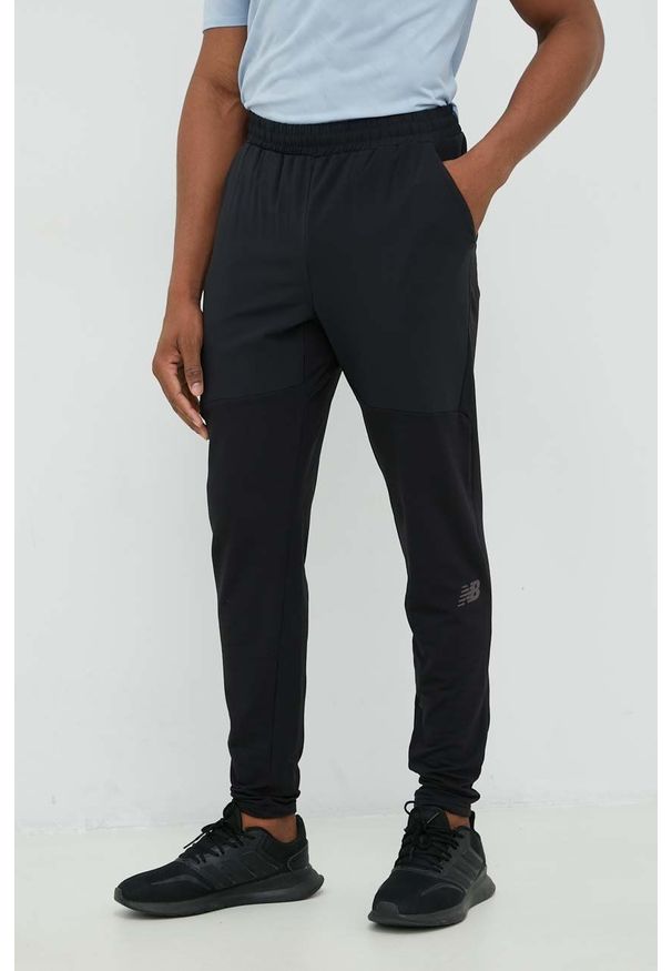 New Balance spodnie treningowe Q Speed męskie kolor czarny. Kolor: czarny. Materiał: materiał