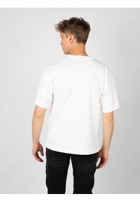 Diesel T-shirt "T-Nlabel" | A11593-0NIAR | Mężczyzna | Biały. Kolor: biały. Materiał: bawełna. Wzór: aplikacja. Styl: elegancki