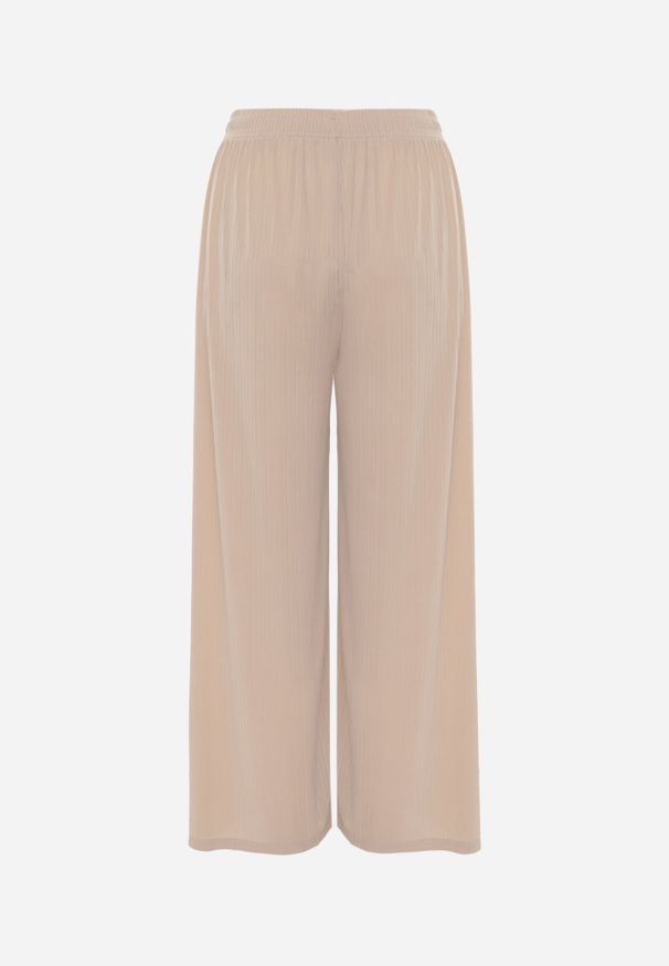 Renee - Beżowe Szerokie Spodnie High Waist z Prążkowanej Tkaniny z Ozdobnym Guzikiem Dalifa. Stan: podwyższony. Kolekcja: plus size. Kolor: beżowy. Materiał: tkanina, prążkowany. Długość: krótkie. Styl: glamour